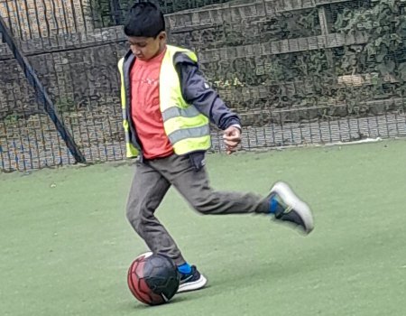 Playing football in afterschool club
