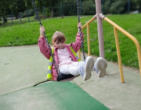 Playing on swings at afterschool club